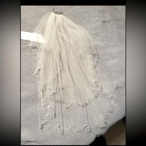 Ivory beaded wedding veil with hair clip